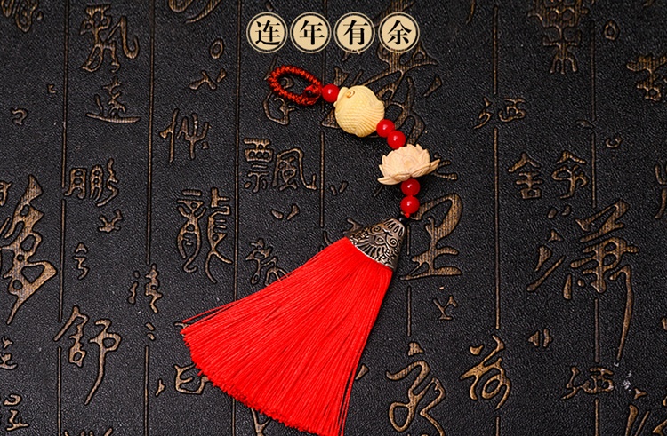 中國風(fēng)流蘇木雕，年年有余細膩木雕